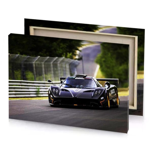 a black and orange race car driving down track gray canvas - Image 4