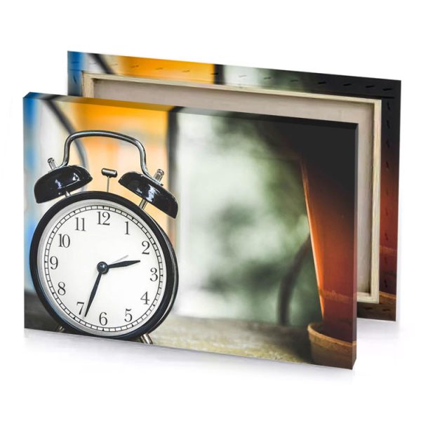 a clock sitting on table next to pot platinum canvas - Image 4