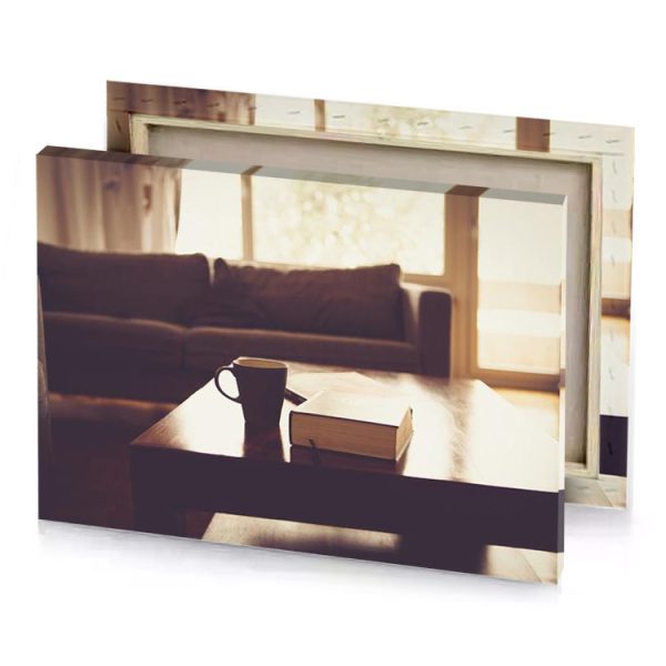 a coffee cup sitting on table in living room taupe canvas - Image 4