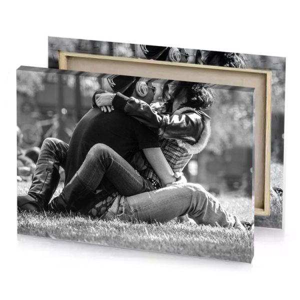 a couple is sitting on the grass in park smoky black canvas - Image 4