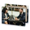 a man and woman sitting at table with laptop smoky black canvas - Image 4