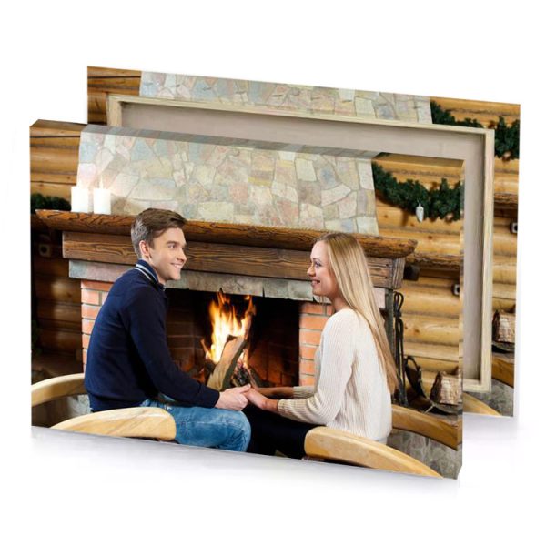 a man and woman sitting in front of fireplace silver canvas - Image 4