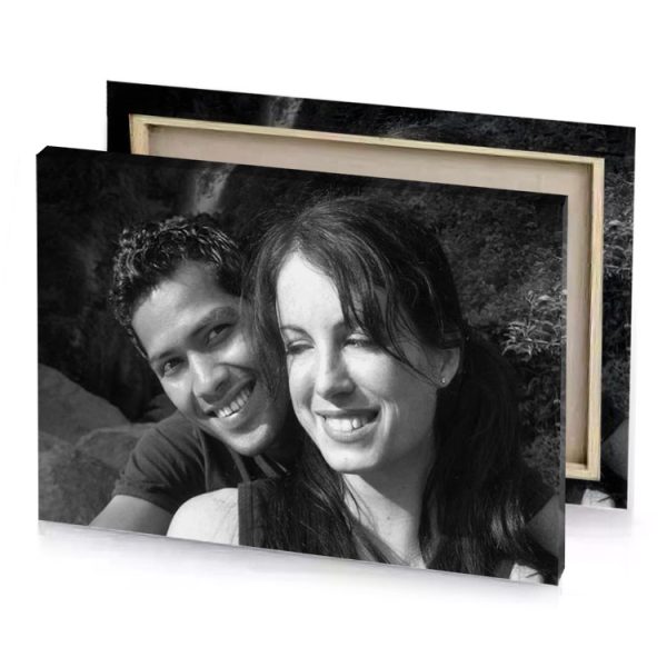 a man and woman sitting on rock smoky black canvas - Image 4