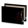 a man in red caper standing the dark burgundy canvas - Image 4