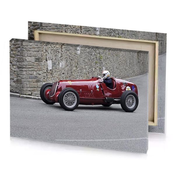 a red car driving down road next to stone wall bistre canvas - Image 4