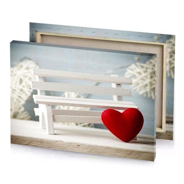 a red heart sitting on top of white bench silver canvas - Image 4
