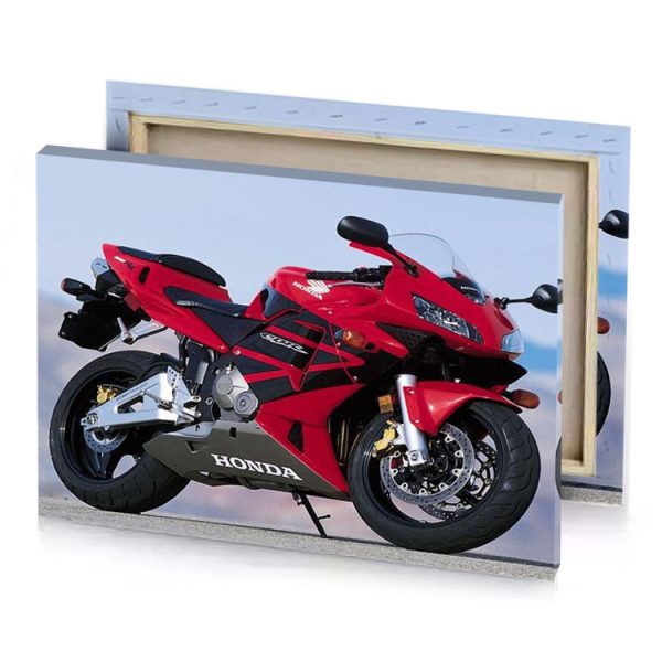 a red motorcycle parked on road next to mountain brown canvas - Image 4