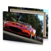 a red sports car driving down street garnet canvas - Image 4