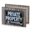 a sign on wooden fence that says private property light steel blue canvas - Image 4