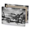 a small propeller plane parked on cement lot silver canvas - Image 4