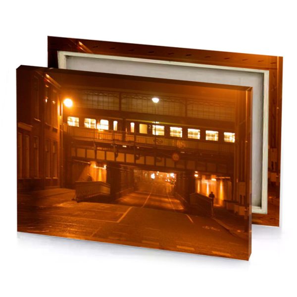 a street at night with train going under bridge saddle brown canvas - Image 4