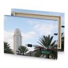 a traffic light and street sign in front of tall periwinkle canvas - Image 4