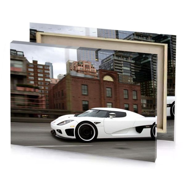 a white sports car driving down city street taupe canvas - Image 4
