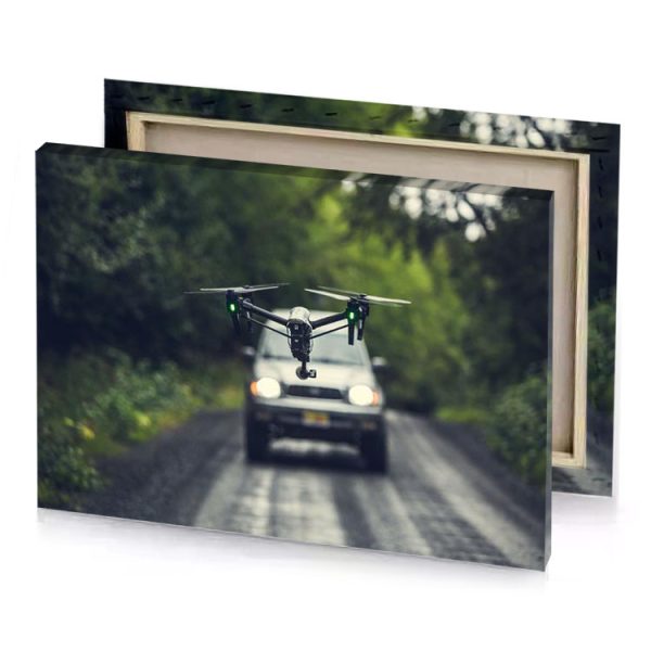 a drone flying over car on road fern green canvas - Image 4