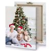 a family sitting on the floor in front of christmas platinum canvas - Image 4