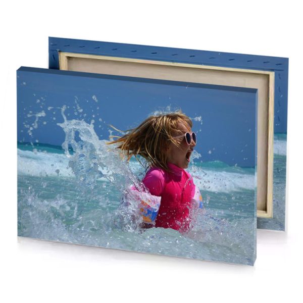 a little girl in the ocean with her hair blowing brown canvas - Image 4