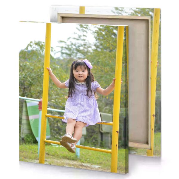 a little girl is sitting on swing yellow orange canvas - Image 4