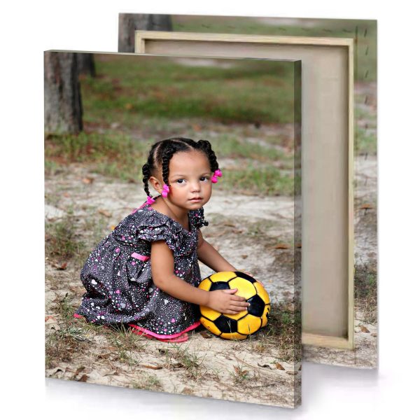 a little girl sitting on the ground with soccer ball camouflage green canvas - Image 4