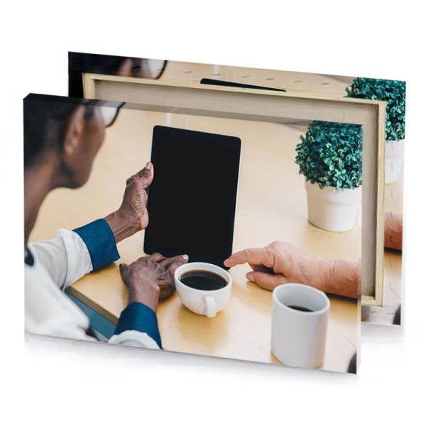 a man and woman sitting at table with tablet smoky black canvas - Image 4