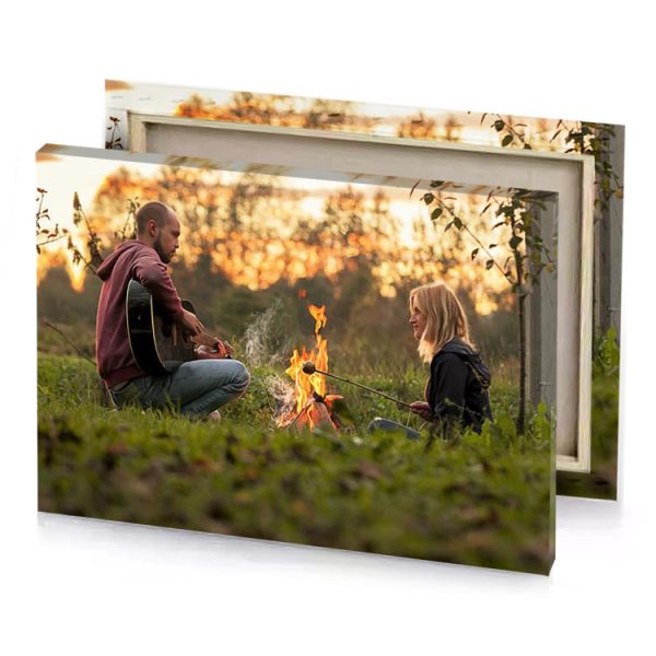 a man and woman sitting by fire sand brown canvas - Image 4