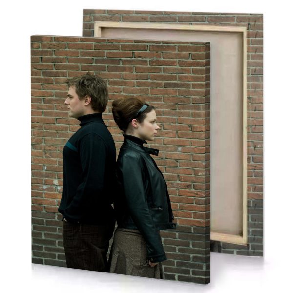 a man and woman standing next to brick wall dark olive green canvas - Image 4