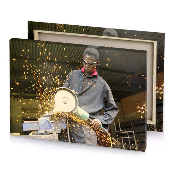 a man cutting piece of metal with circular saw bistre canvas - Image 4