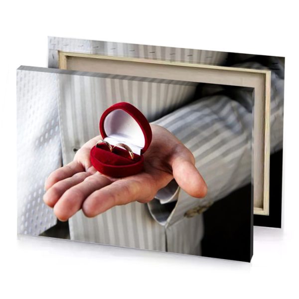 a man holding ring in his hand zinnwaldite brown canvas - Image 4