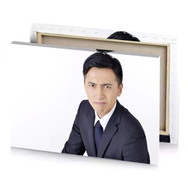 a man in suit and tie sitting down snow canvas - Image 4