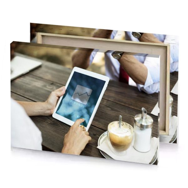 a man sitting at table using tablet prussian blue canvas - Image 4