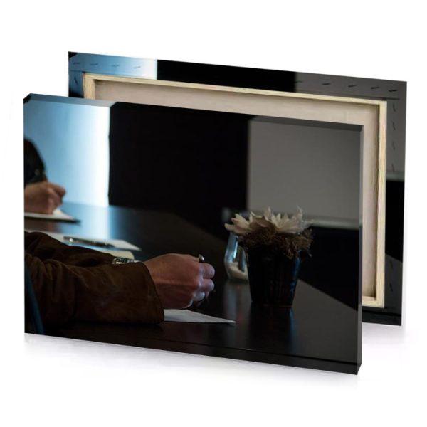 a man sitting at table writing on piece of paper smoky black canvas - Image 4