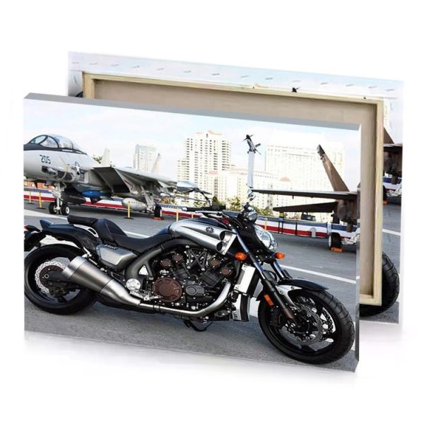 a motorcycle parked on the street next to an airplane smoky black canvas - Image 4