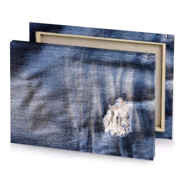a pair of jeans with holes and hole in the slate gray canvas - Image 4