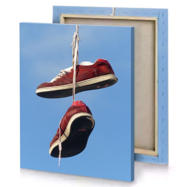 a pair of red shoes hanging from string garnet canvas - Image 4