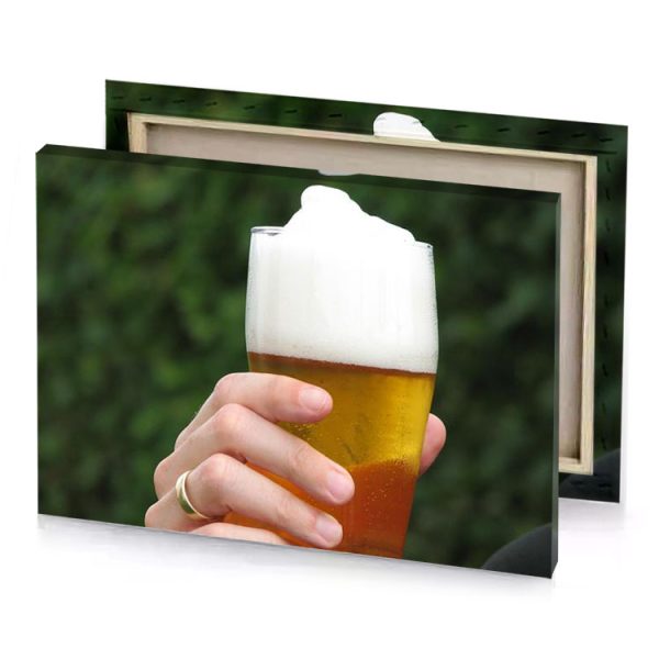 a person holding beer glass with foam on it saddle brown canvas - Image 4