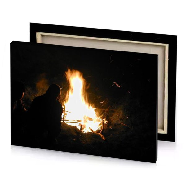 a person sitting in front of fire blanched almond canvas - Image 4