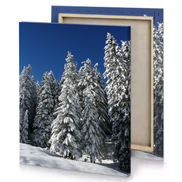 a person skiing down snowy slope with trees in the dark cornflower blue canvas - Image 4