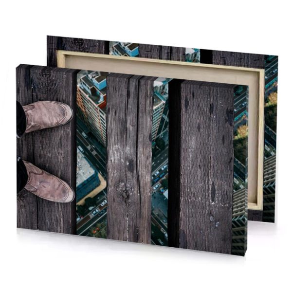 a person standing on wooden bench with their feet the gray canvas - Image 4