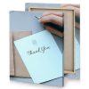 a person writing on piece of paper light cyan canvas - Image 4