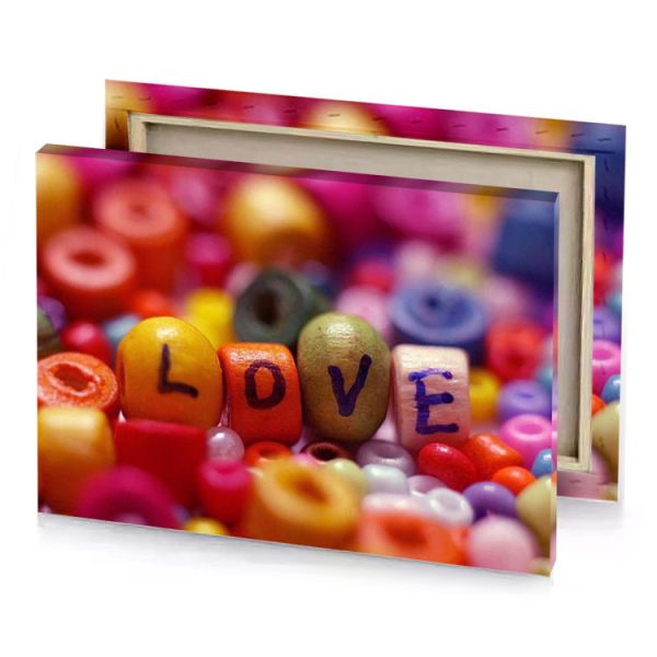 a pile of colorful beads with the word love spelled firebrick canvas - Image 4