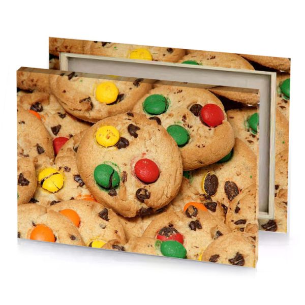 a pile of cookies with m and on them fern green canvas - Image 4