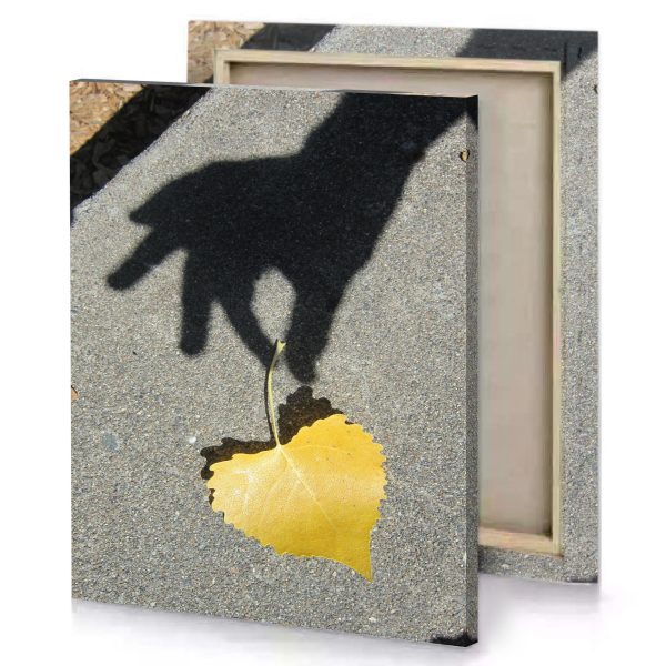 a shadow of person holding leaf yellow orange canvas - Image 4