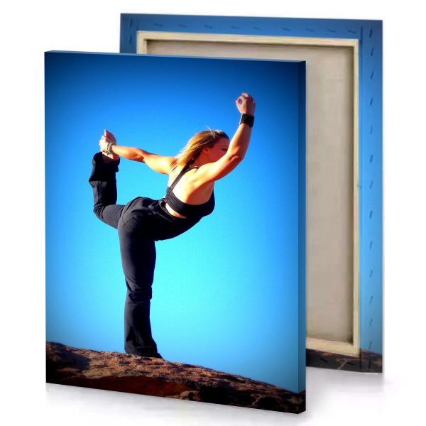 a woman doing yoga pose on rock aquamarine canvas - Image 4
