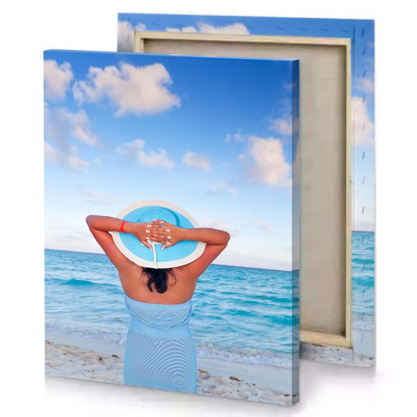 a woman in blue dress and hat on the beach fuzzy wuzzy brown canvas - Image 4