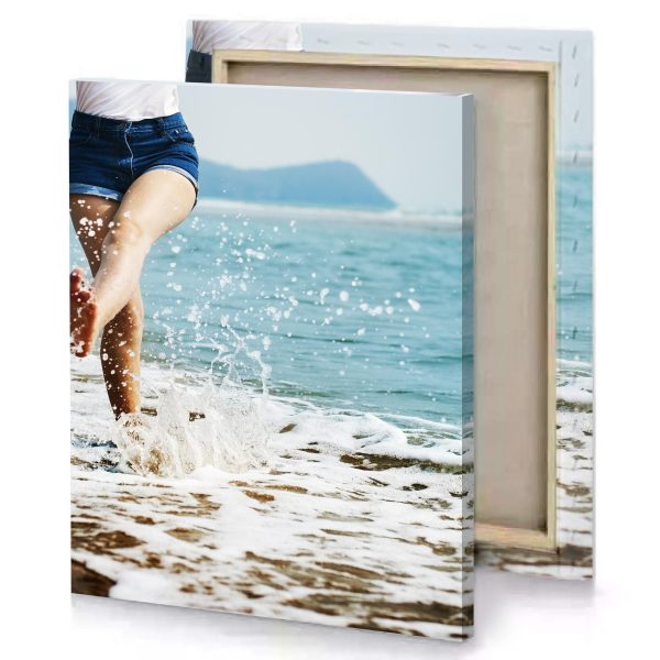 a woman is running in the water on beach light steel blue canvas - Image 4