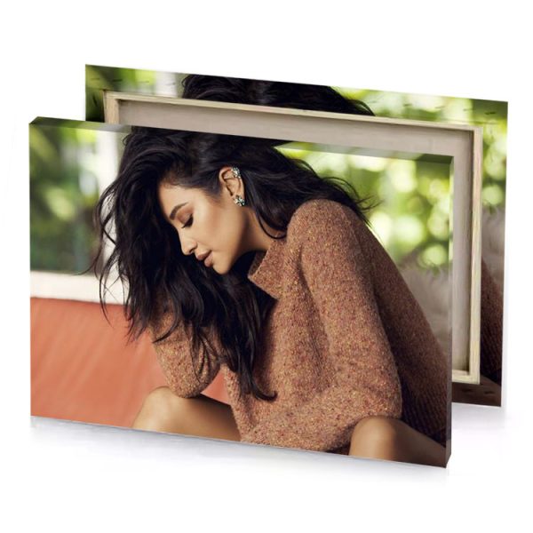 a woman sitting on couch with her head down smoky black canvas - Image 4