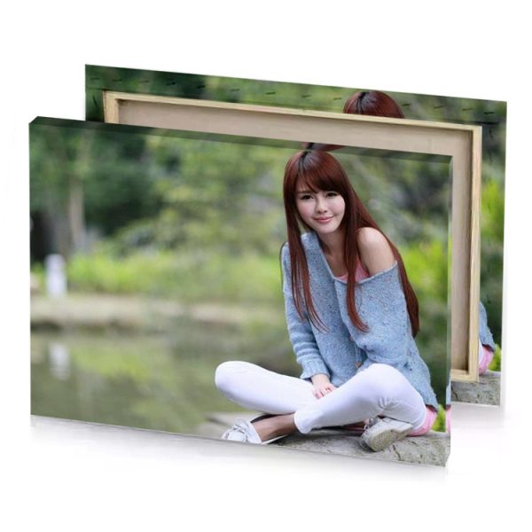 a woman sitting on rock near river camouflage green canvas - Image 4