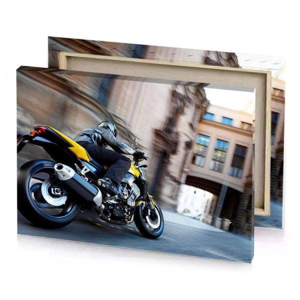 a yellow motorcycle is driving down the street smoky black canvas - Image 4