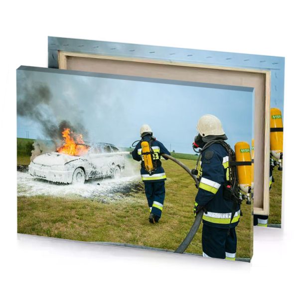 two firefighters in blue uniforms are putting a car on light canvas - Image 4