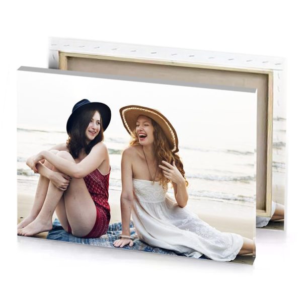 two women sitting on the beach white smoke canvas - Image 4