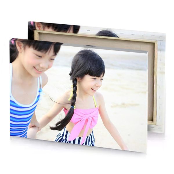 two young girls are playing on the beach linen canvas - Image 4